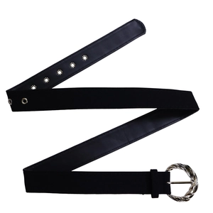 Detail of high-waist black leather belt with textured silver metal buckle and eyelets