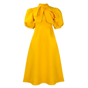 Detailed view of puff sleeves and elegant bow tie neckline on the ginger yellow A-line dress