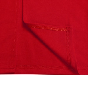 Close-up detail of double-stitched hem and overlock seams on red evening dress fabric