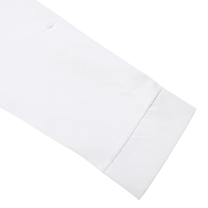 Macro detail of high-quality white cotton shirt cuff with button and neat stitching