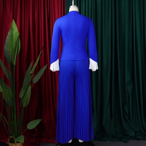 Detail of royal blue blazer with white pleated flared sleeves and matching wide-leg pants