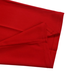 Detail shot of the double-needle stitching on the hem of a red cotton blend jumpsuit