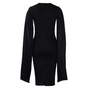Back view of black slim dress showing invisible zipper and pleated long sleeve details