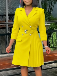 Fashionable bright yellow double-breasted blazer dress with pleated skirt and waist belt