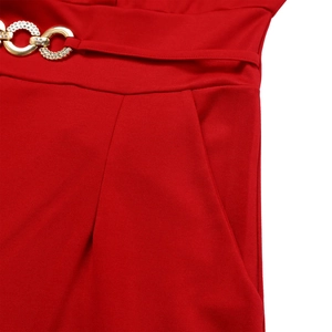Close-up of red high-waist jumpsuit featuring a gold double-ring buckle and side pocket