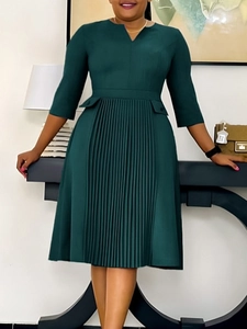 Elegant dark green V-neck dress with pleated skirt and half sleeves in professional style