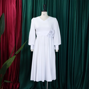 Detailed white long sleeve V-neck dress featuring a large waist flower and pleated skirt