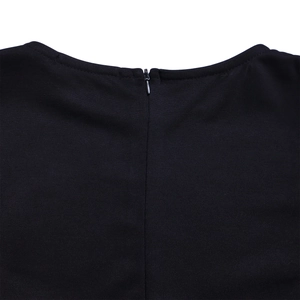 Macro detail of the high-quality invisible zipper on the back neckline of the black dress