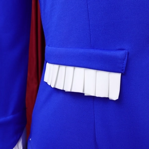 Macro view of blue textured fabric with white pleated details and red lining on the outfit