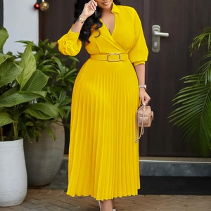 Detail of V-neck long sleeve pleated maxi dress in bright yellow with matching waist belt