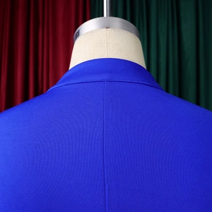Detailed view of the back collar and shoulder fabric on a royal blue flared sleeve top