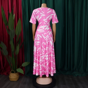 Detail view of the hidden back zipper on a pink African print maxi dress with short sleeves