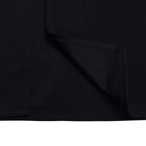 Close-up of high-quality stitching and vertical texture on black pleated dress hem