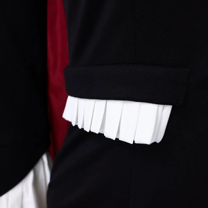 Detail of flared sleeves with white pleats and red lining on a plus-size two-piece set