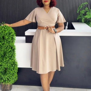 Detail of khaki wrap V-neck dress with ruffle sleeves and brown buckled waist belt