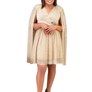 Close-up of gold metallic pleated dress with elegant V-neck and cape sleeves detail