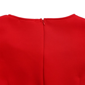 Close-up of the red dress showing neat sewing and a high-quality invisible back zipper