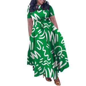 Detail of waist-tie on green African print plus size dress with white abstract patterns