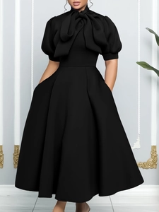 Elegant black puff sleeve dress with bow collar and flared A-line silhouette for formal events