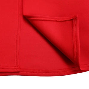 Detailed close-up of side slit design and stitching on elegant solid red dress
