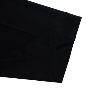 Close-up of precision stitching and premium black woven fabric on wide-leg jumpsuit hem