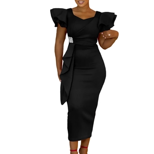 Detail of elegant black dress with ruffled sleeves and a sparkling rhinestone buckle