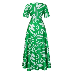 Detail of green African print dress with white abstract patterns and hidden back zipper