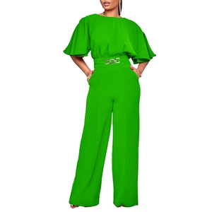 Green wide-leg jumpsuit with ruffled sleeves and decorative silver chain belt detail