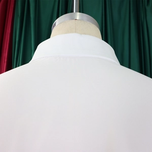 Close-up detail of high-quality stitching on the back collar and shoulder of white shirt