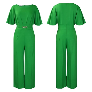 Close-up of emerald green jumpsuit with tiered sleeves and golden waist decoration