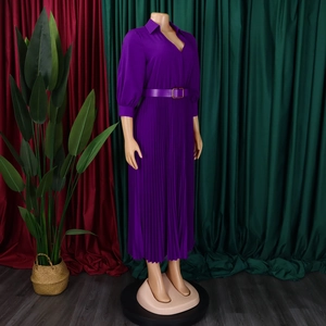 Detailed view of purple pleated maxi dress with elegant gold buckle leather belt