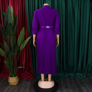 Detail view of deep purple pleated maxi dress back with waist belt and long sleeves