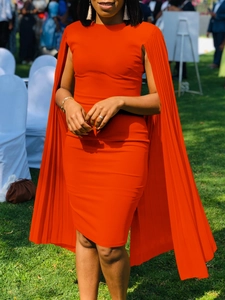 Elegant bright orange bodycon evening dress featuring pleated cape sleeves and a round neck