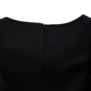 Close-up of the elegant back invisible zipper and stitching on this black ruffle dress