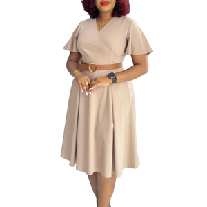 Detail of elegant V-neck dress with flutter sleeves and brown leather belt at waist