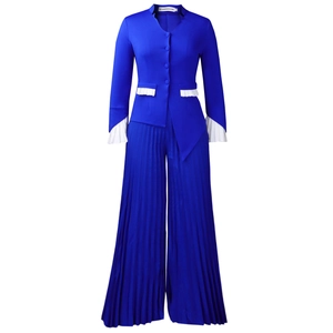 Detail of royal blue blazer with white pleated cuffs and matching wide-leg trousers