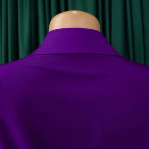 Detail of purple satin V-neck dress showing the back neckline and fabric luster