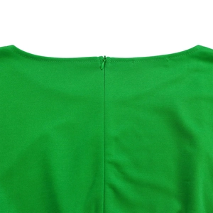 Detailed close-up of the hidden zipper on the back of a bright green wide-leg jumpsuit