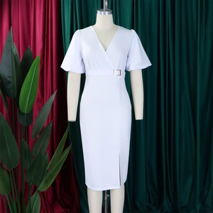 Detail of elegant white V-neck dress featuring puff sleeves and a waist gold buckle
