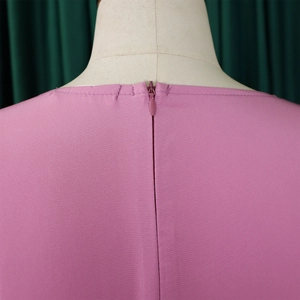 Detail of invisible zipper closure on the back of this elegant dark pink A-line dress
