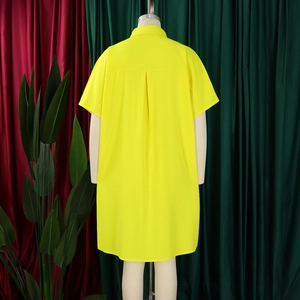 Rear view of yellow short-sleeved dress with a classic lapel and box pleat detail