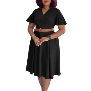 Detail of V-neck wrap dress with ruffle sleeves and brown leather belt with metal buckle