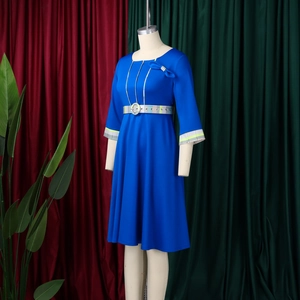 Detail of royal blue dress featuring elegant neckline bow and plaid patchwork trim