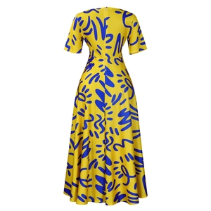 Detail view of the high waist cut and hidden back zipper on yellow African print dress