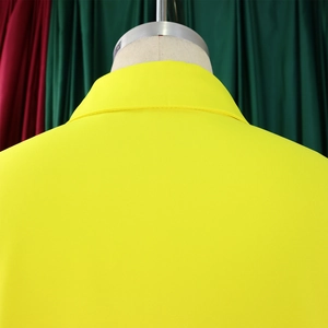 Detail view of the collar and back structure of a bright yellow lapel shirt dress