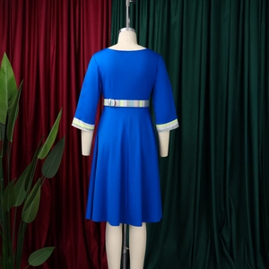 Detail view of royal blue dress featuring elegant plaid patchwork on sleeves and waistline