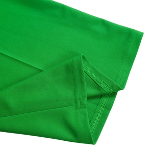Detail view of bright green jumpsuit showing professional double-needle stitching and fabric