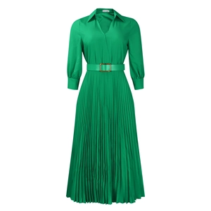 Close-up of emerald green pleated dress with V-neck and belt with gold metal buckle