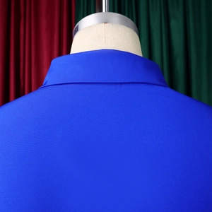 Detail view of bright blue textured fabric and back stitching on this A-line dress