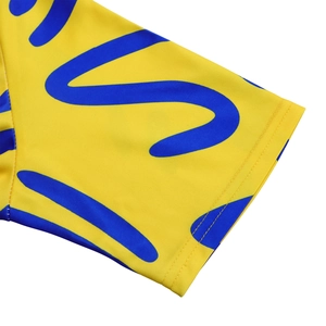 Detail of sleeve cuff with double-needle stitching and yellow abstract African print